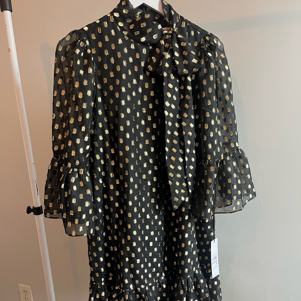 Calvin Klein size 6 dress. NWT. High neck w/ tie detail in front.